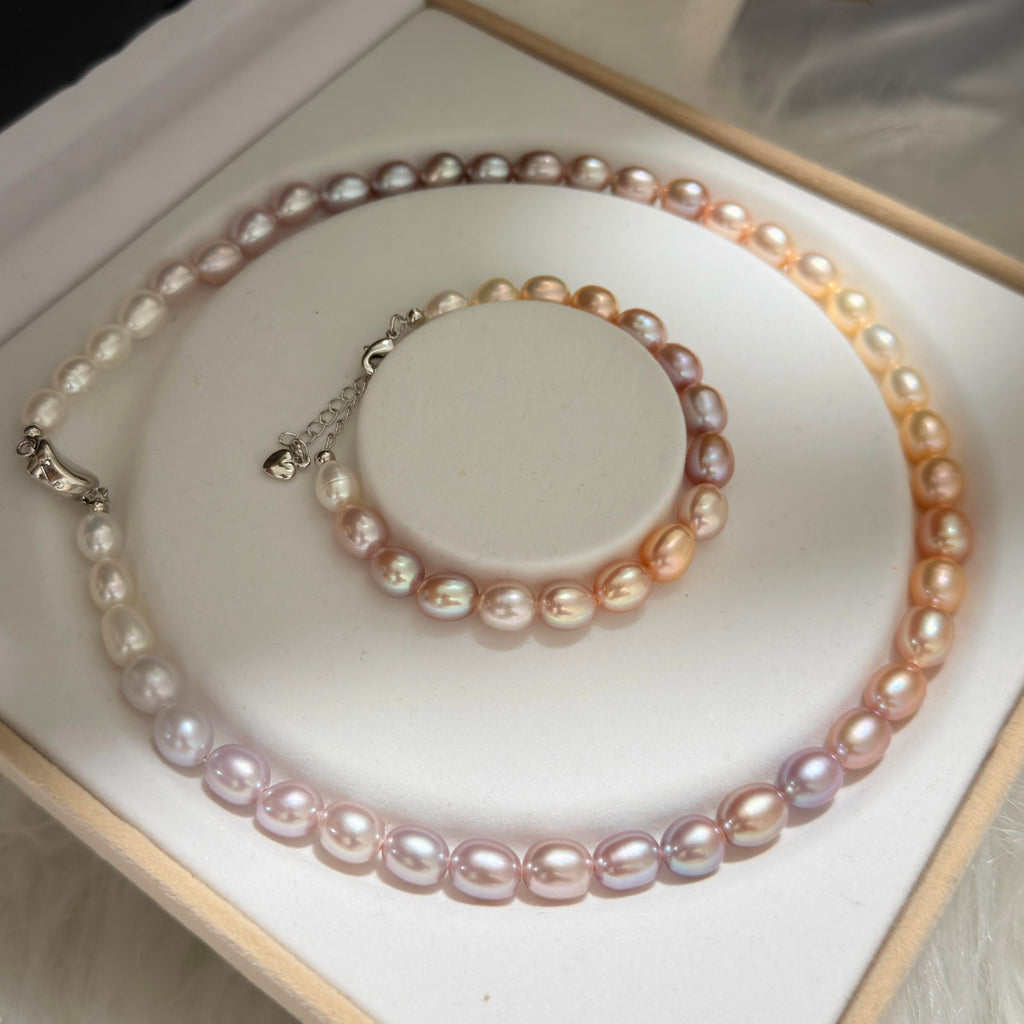 Freshwater pearls shifting from purple and pink to peach and champagne gold.
