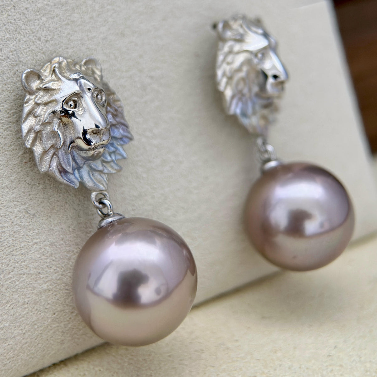 12.5 mm freshwater pearl earrings in a deep bronze tone.