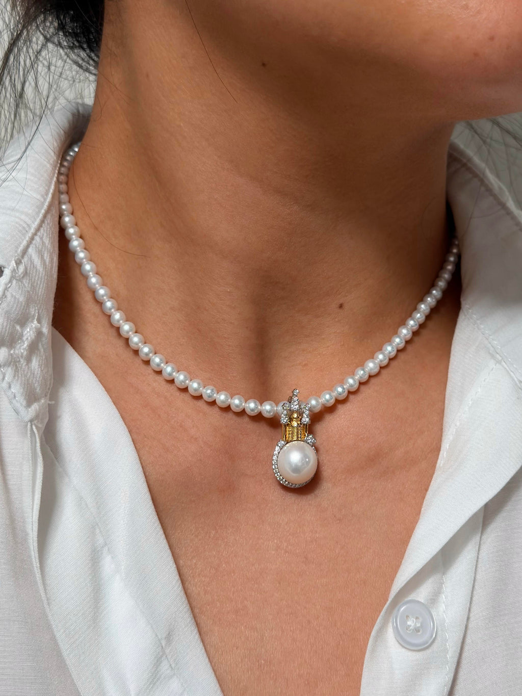 Storybook-inspired castle pearl pendant for special-occasion styling.