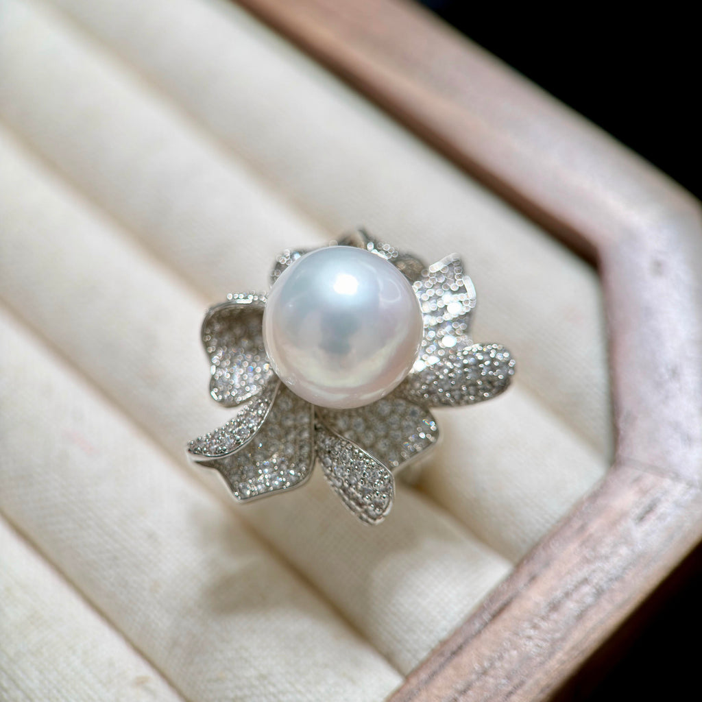 Oversized pearl floral ring with silver-plated sculptural petals.