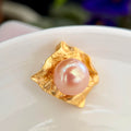 Wrinkled-paper inspired pendant with an 11.8 mm golden freshwater pearl.