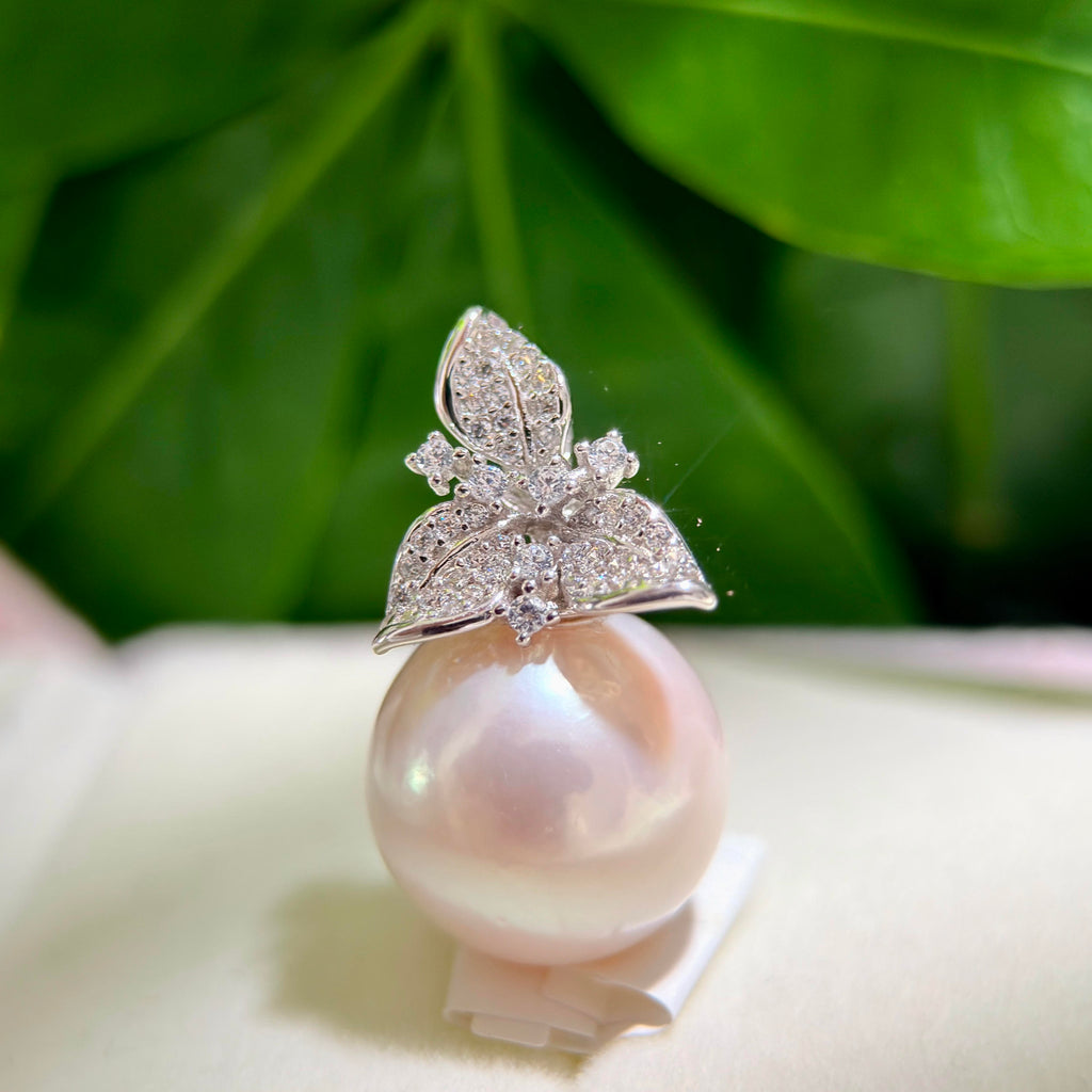 White pearl necklace with pink iridescent halo styled for evening wear.