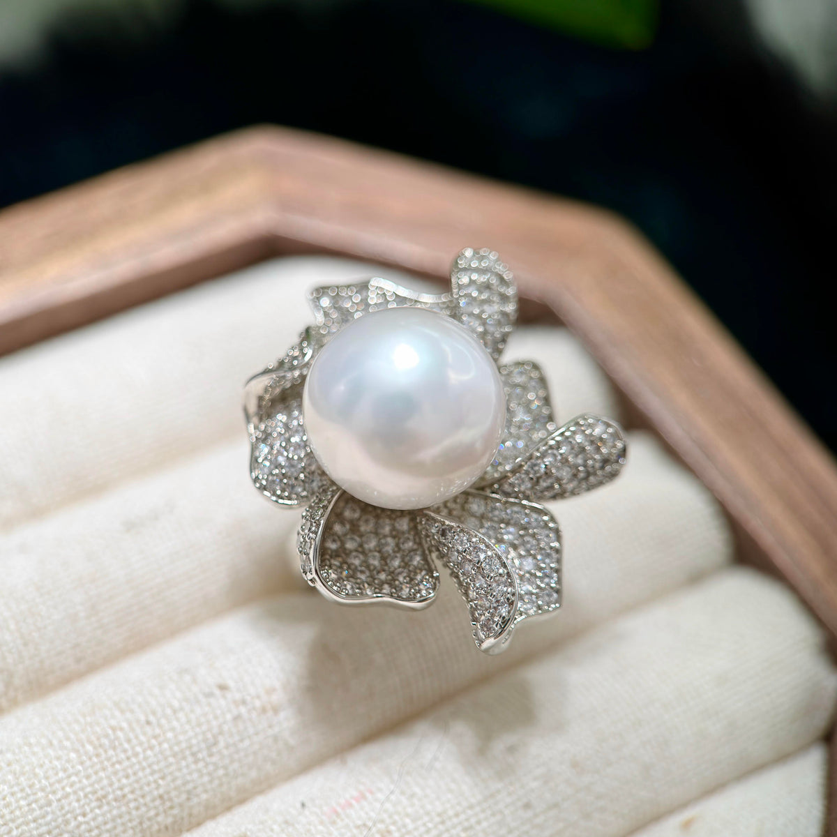 Pink-overtone freshwater pearl statement ring with flower design.
