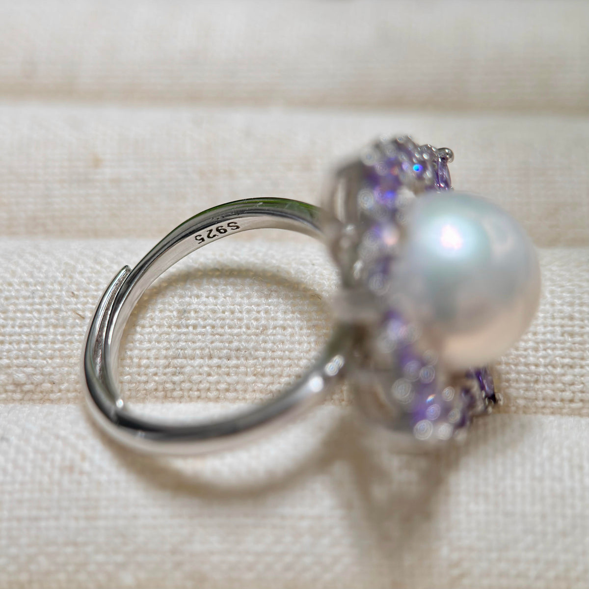 Adjustable floral pearl statement ring in sterling silver.