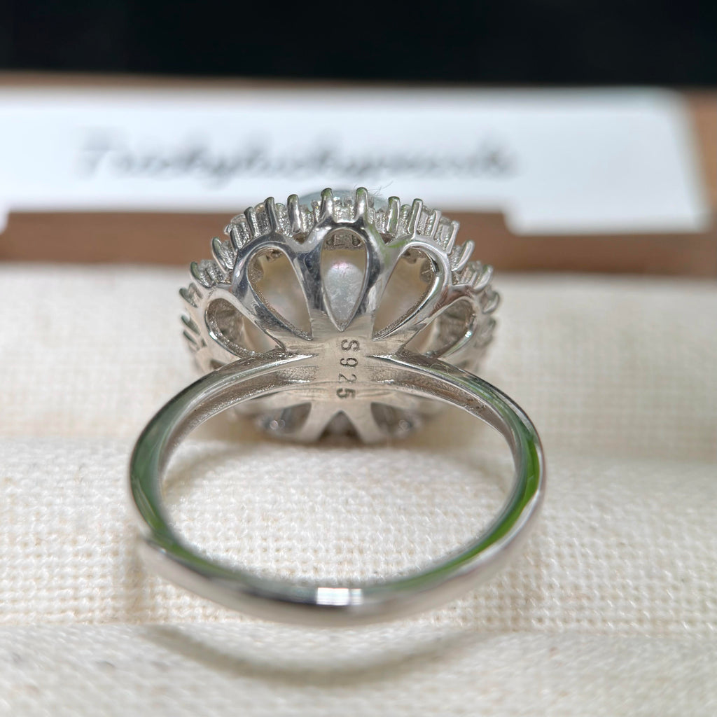 Adjustable pearl ring crafted in sterling silver.