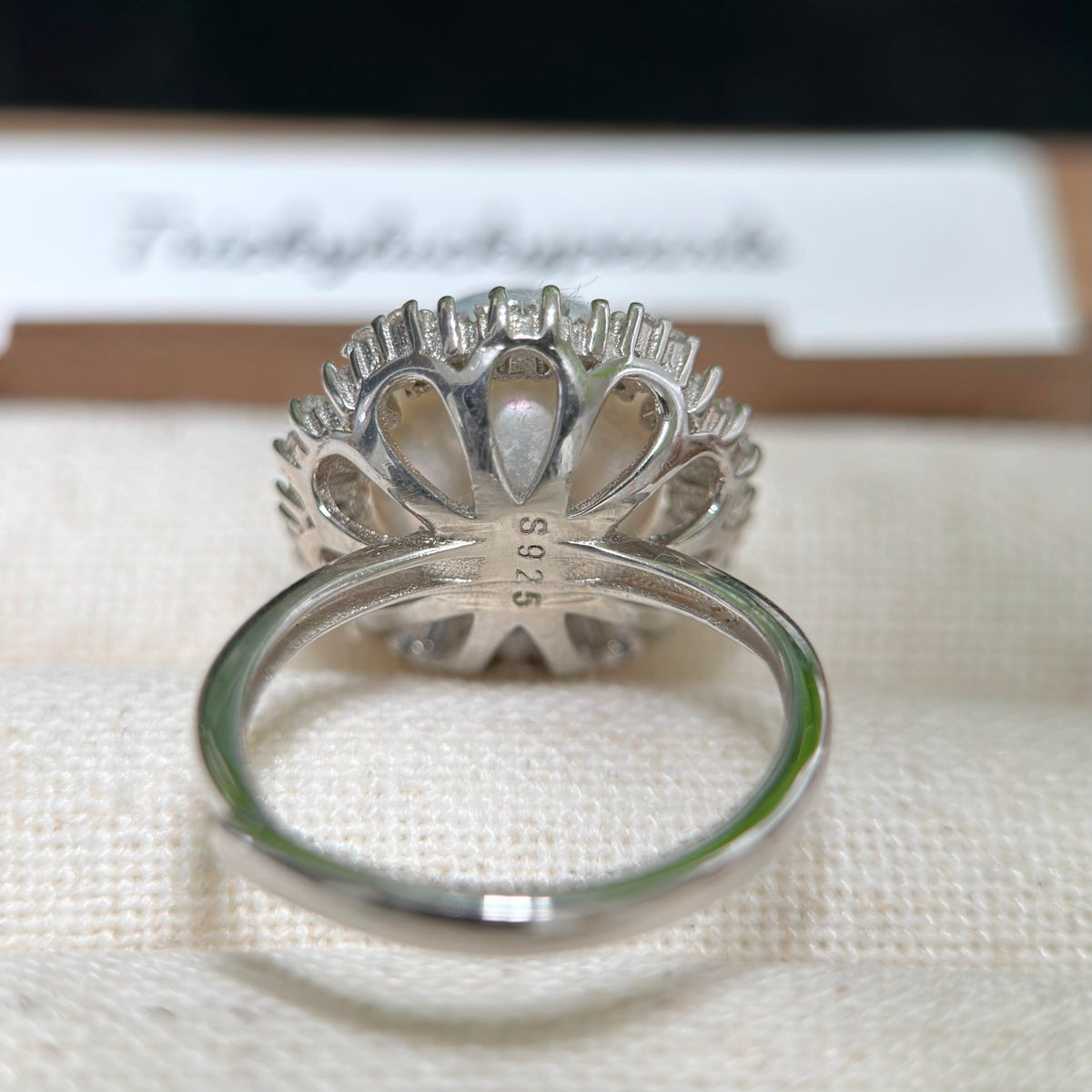 Adjustable pearl ring crafted in sterling silver.