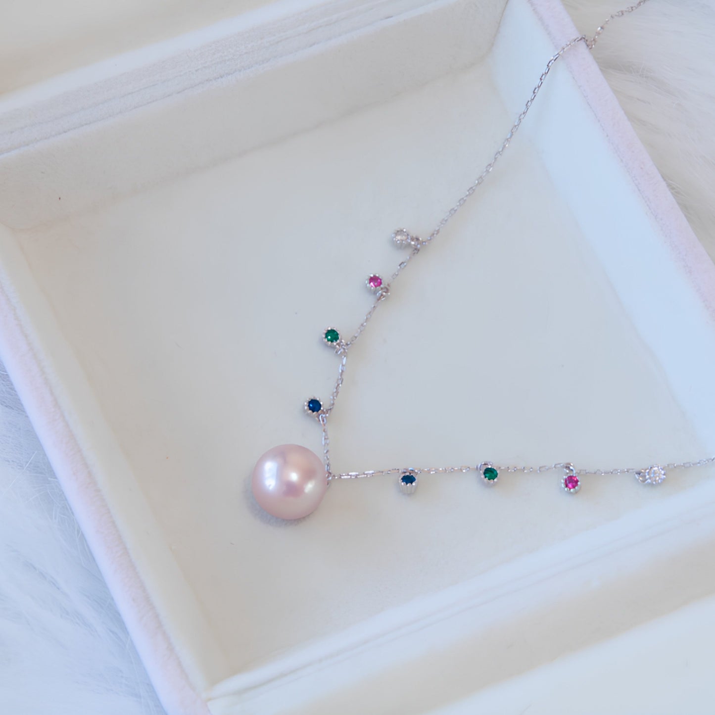 Pearl necklace with colored gemstones