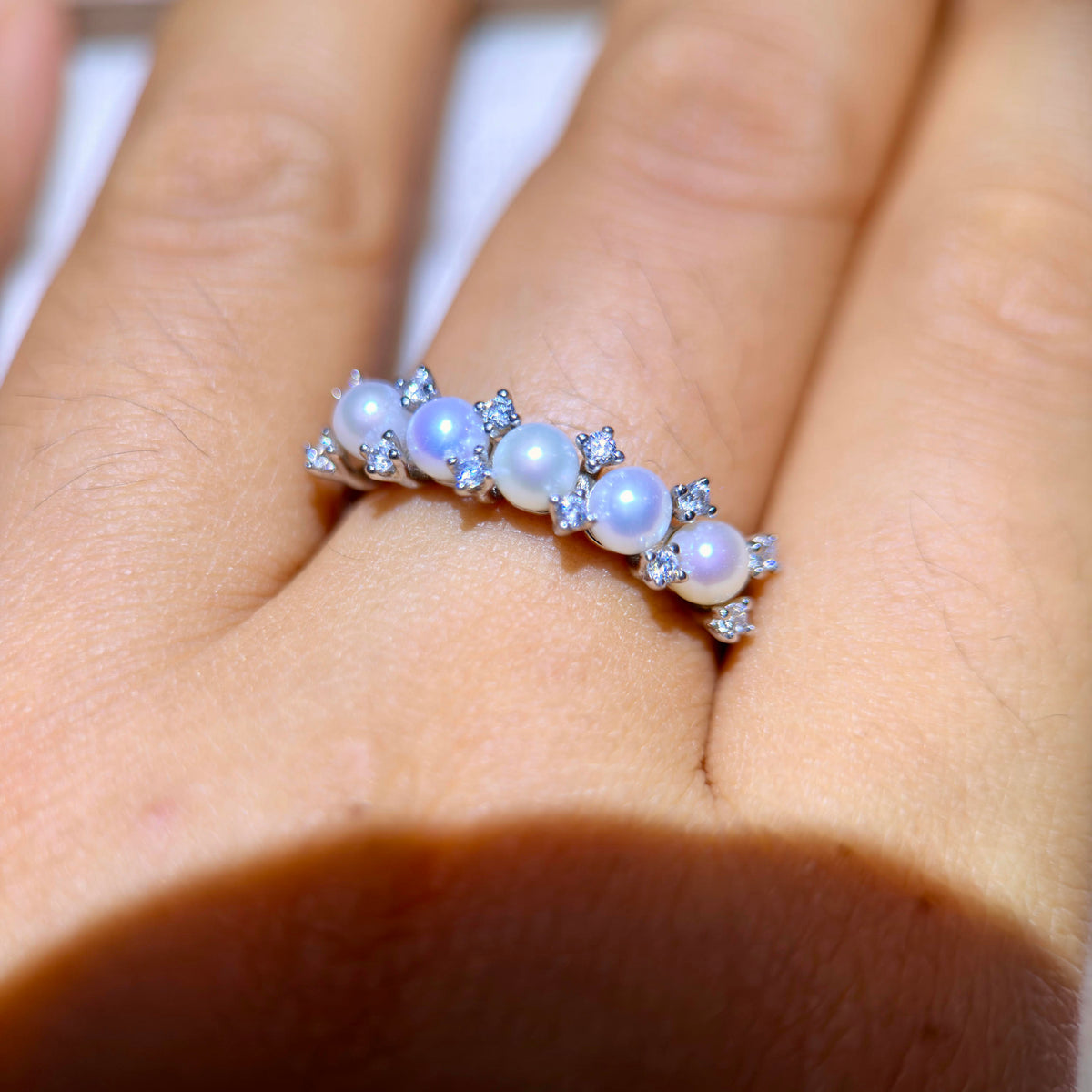 Round freshwater pearls arranged in a crown-inspired ring.