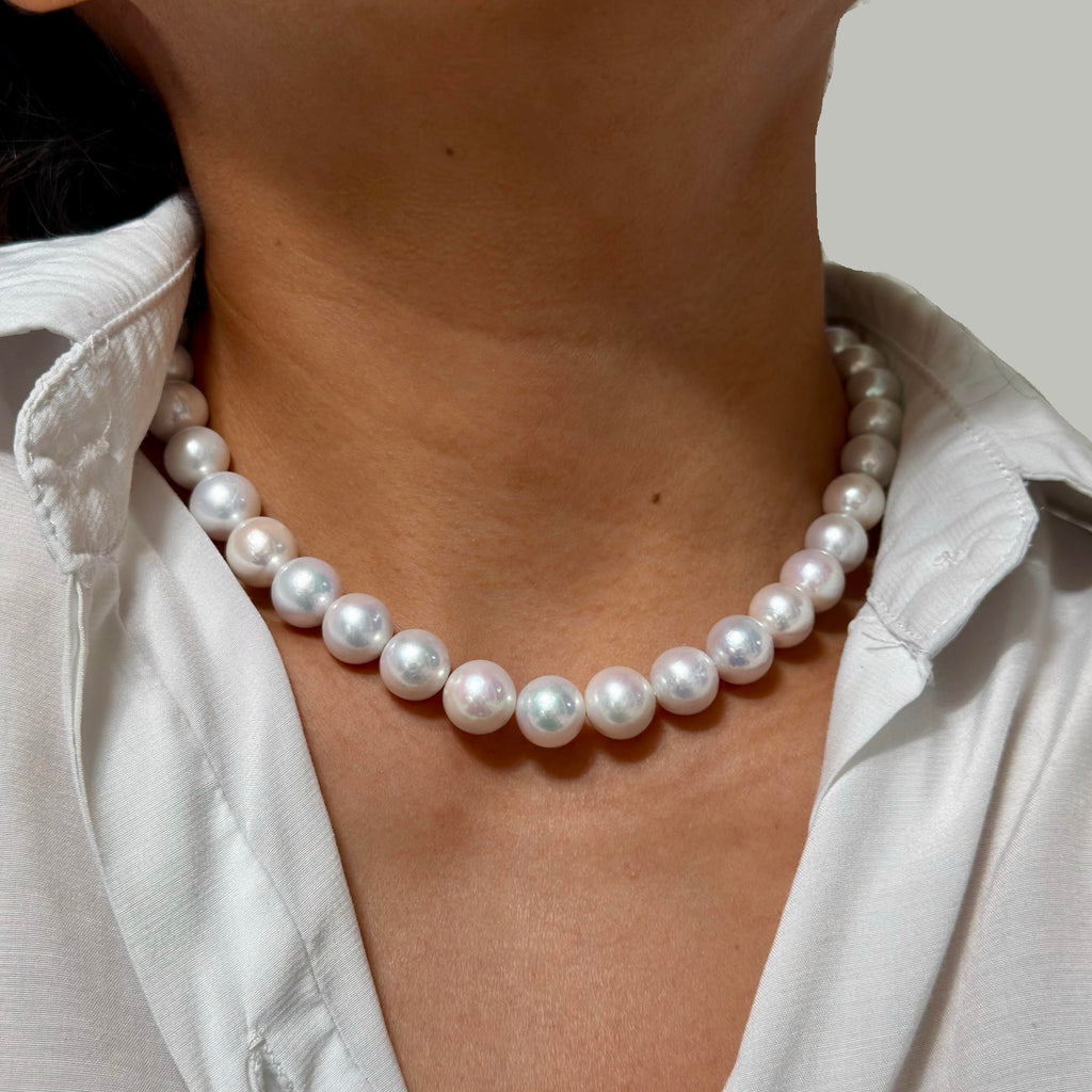 Full strand view of 10–12 mm white with soft pink halo freshwater pearl necklace, 42 cm long.