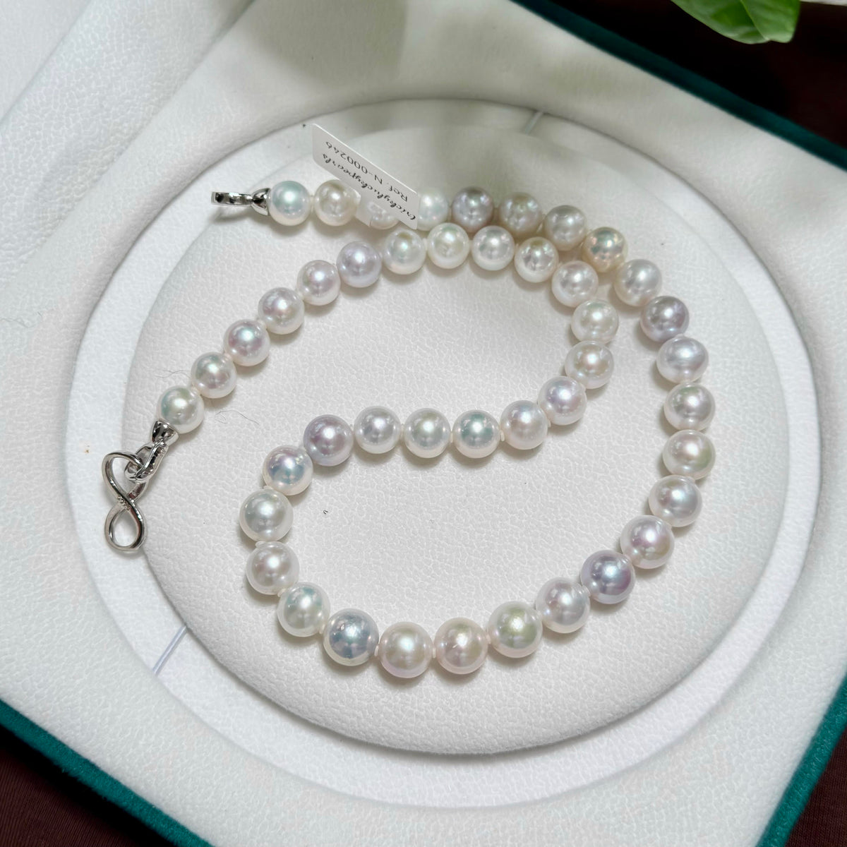 Full strand view of 9–10 mm white with vivid blue and multicolour halo freshwater pearl necklace, 42 cm long.