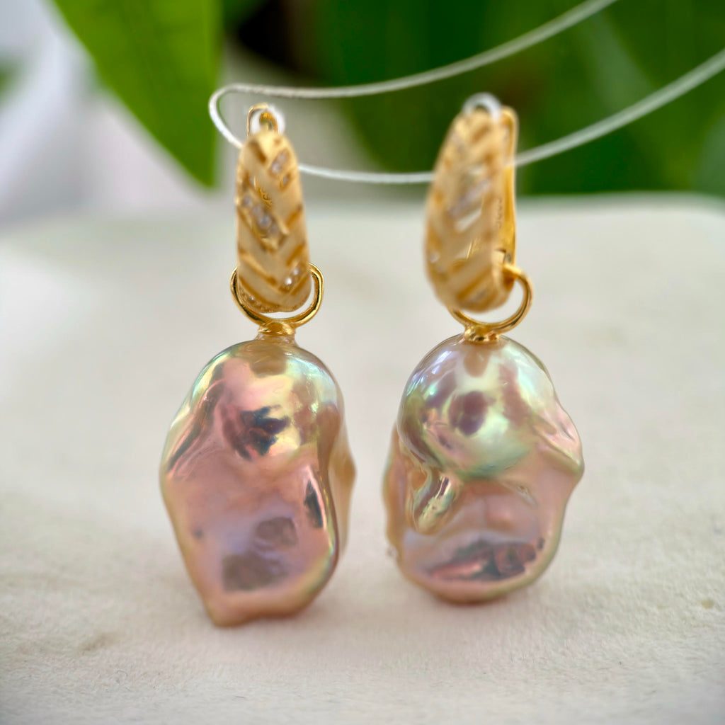 Multicolor baroque pearl earrings with frosted gold hoops.