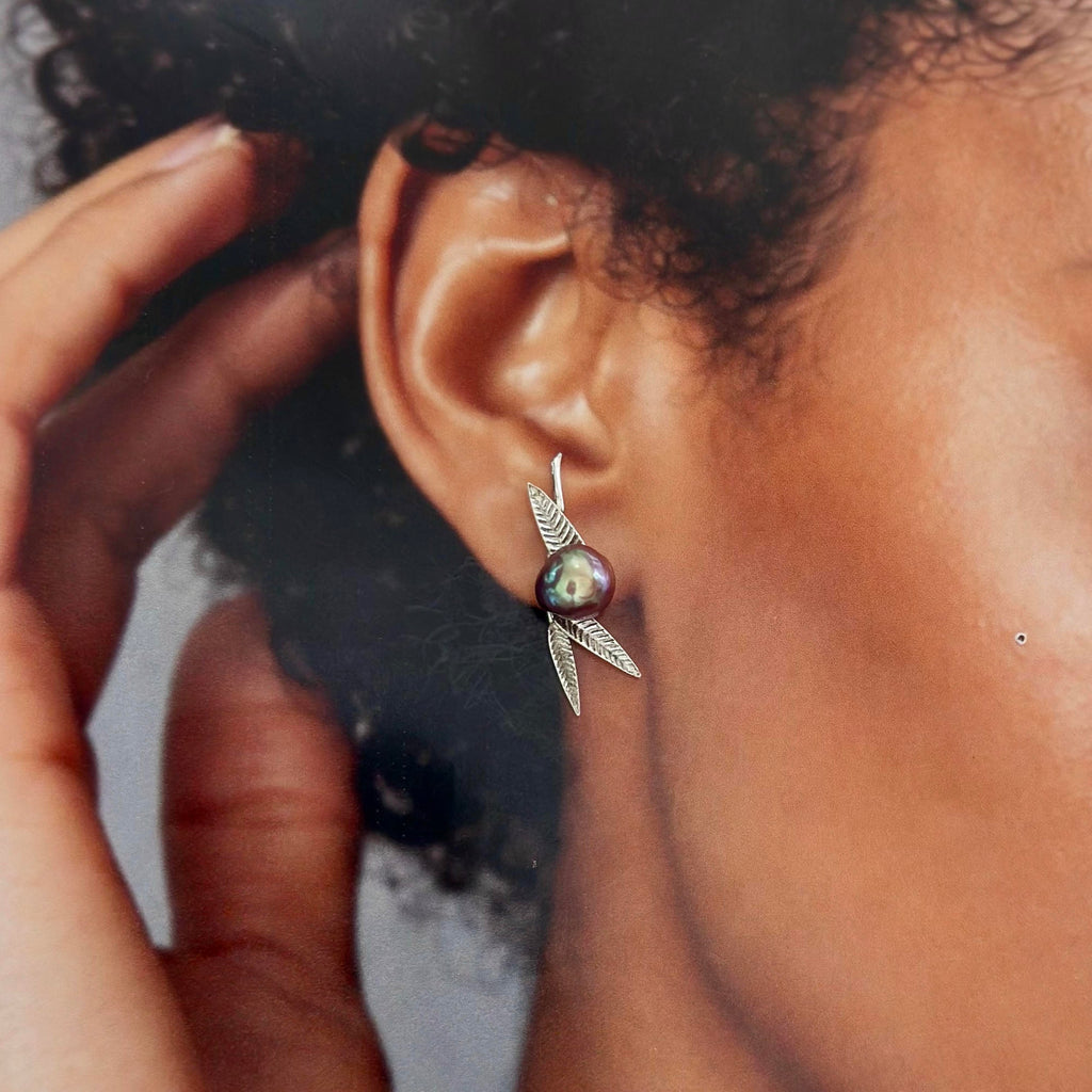 Model wearing bamboo leaf freshwater pearl earrings.