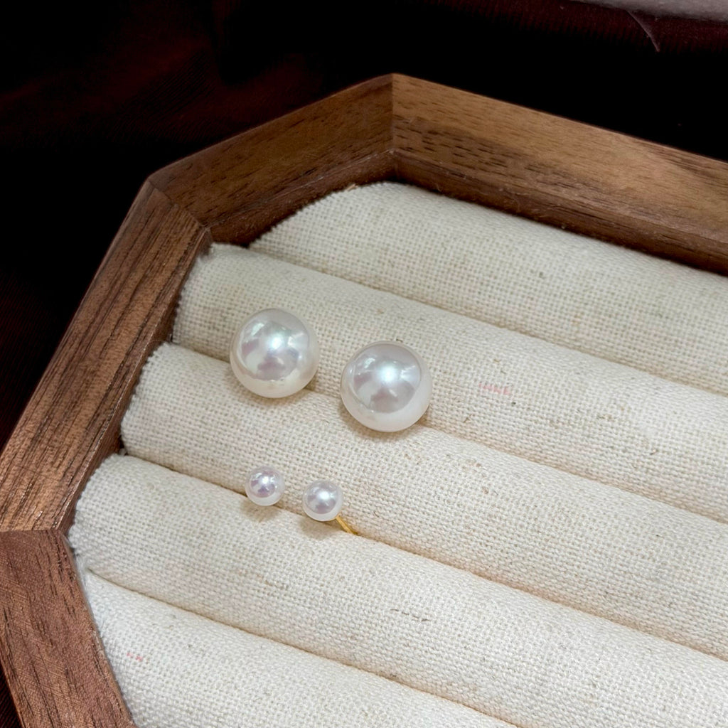 Detachable pearl earrings with 5 mm pearl studs and larger removable pearl backs.