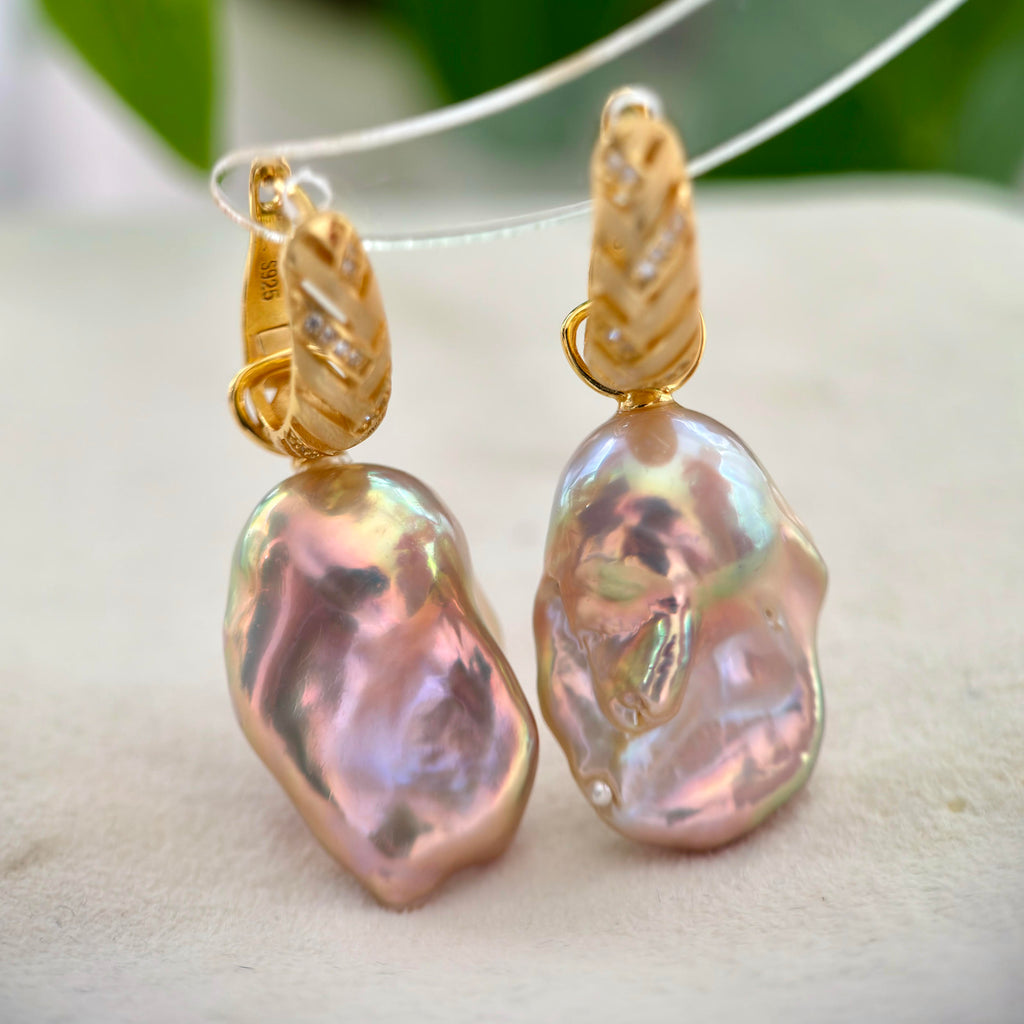 
Large baroque pearl earrings crafted in sterling silver with gold plating.