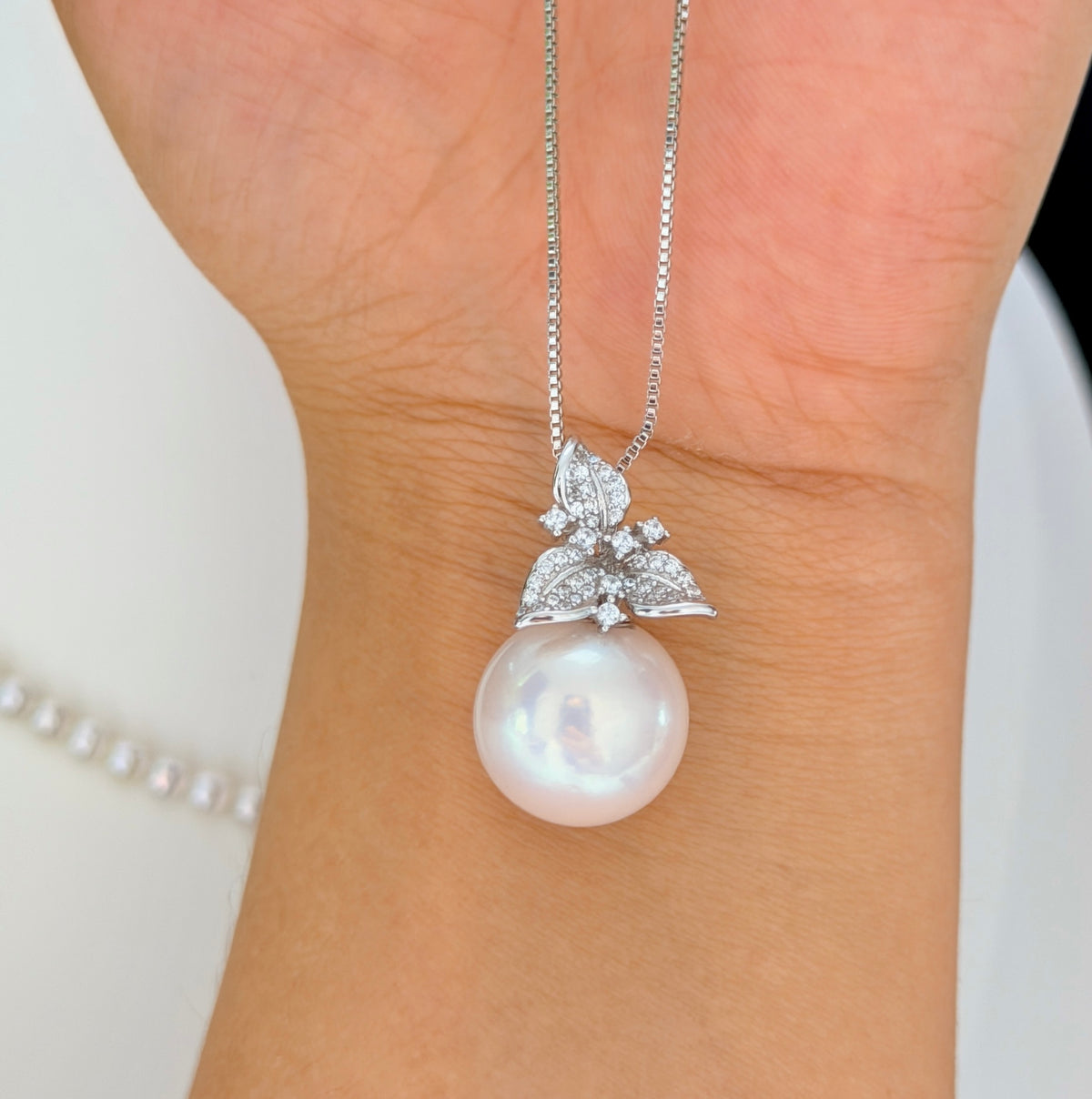 Pink-halo freshwater pearl necklace styled for wedding jewelry.