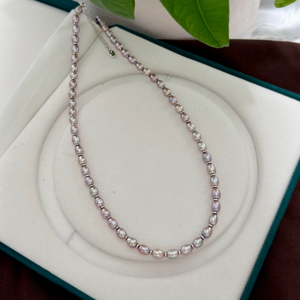 Oval freshwater pearl necklace with exceptionally bright aurora-like lustre.