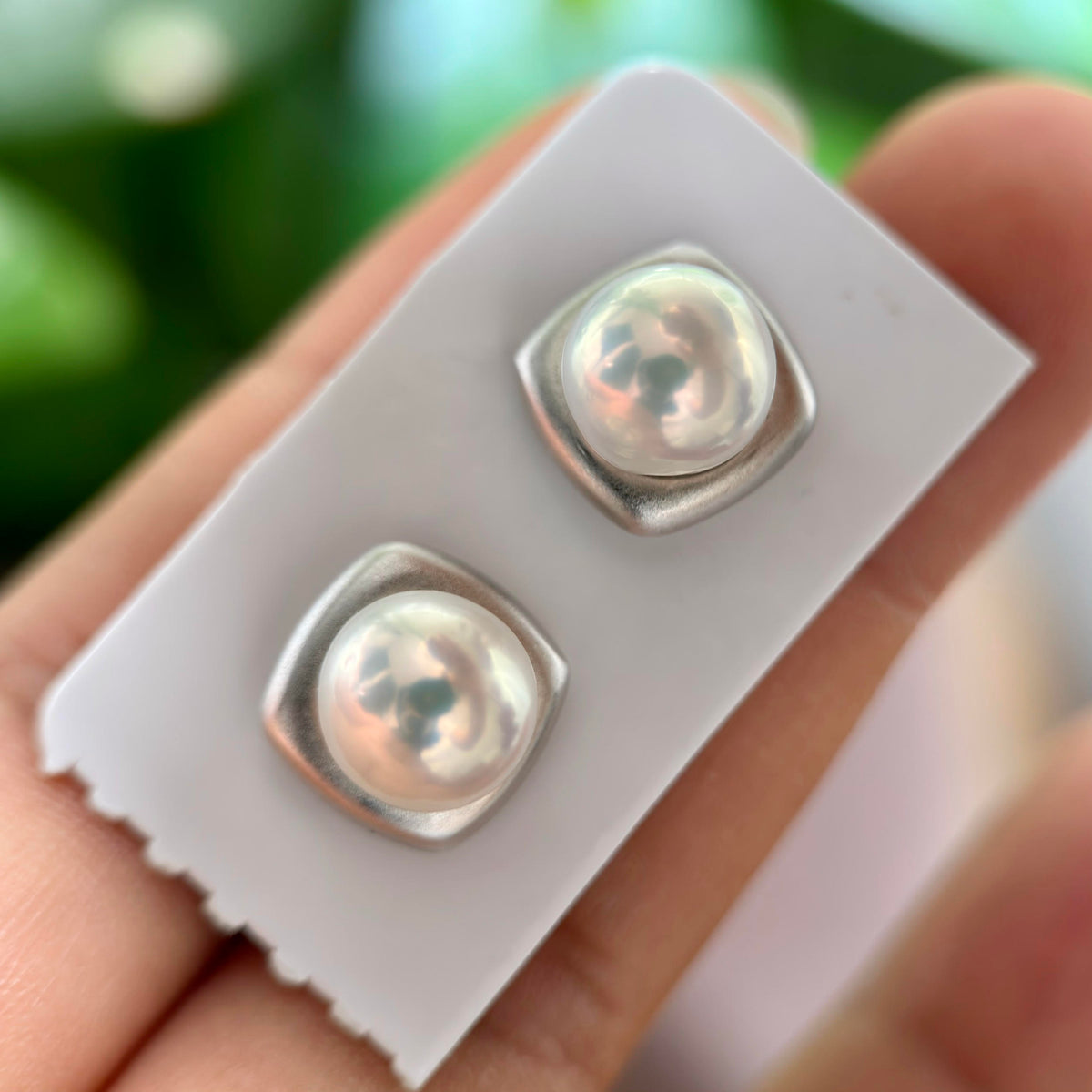 8.8 mm white pearl earrings with a simple contemporary look.
