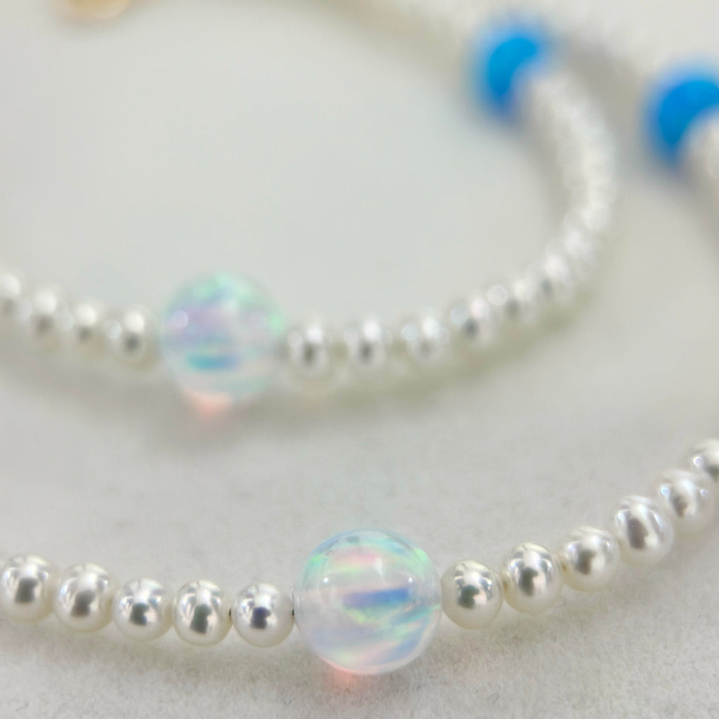Close-up of water opal and white freshwater pearls in the celestial necklace.