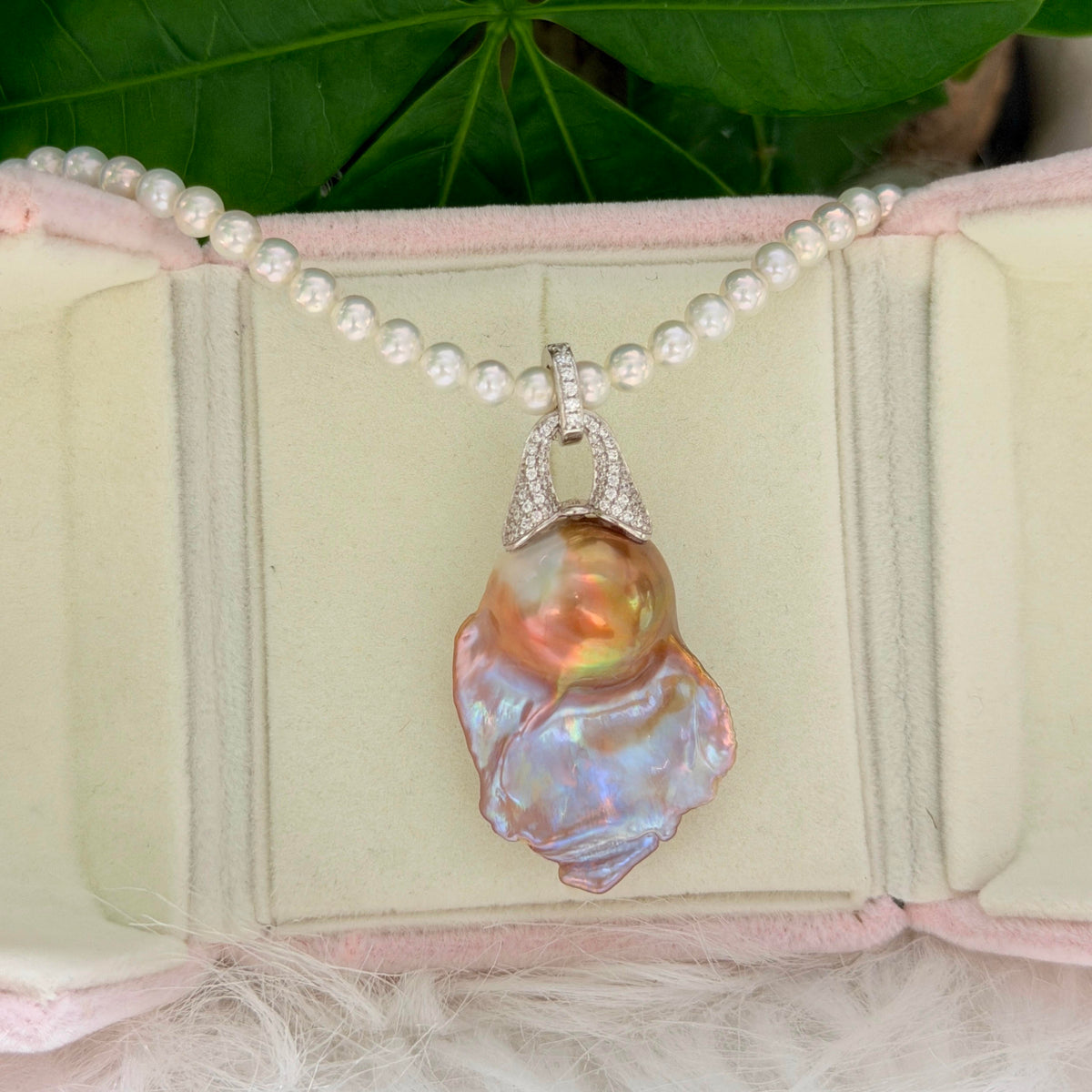 Blue halo baroque pearl pendant with purple and green colour shifts.