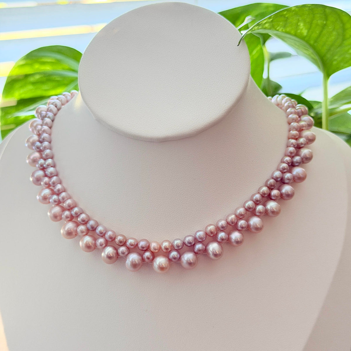 Fairy pink and purple freshwater pearl choker in a delicate woven design.
