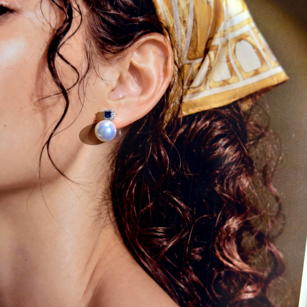 Natural freshwater pearl earrings with cool blue halo.