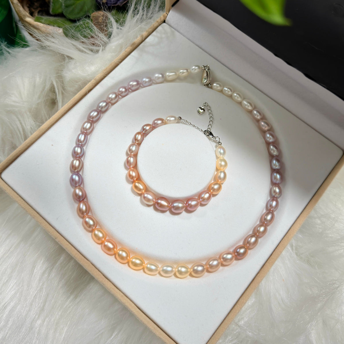 8–9 mm oval freshwater pearls arranged in a coordinated necklace and bracelet set.
