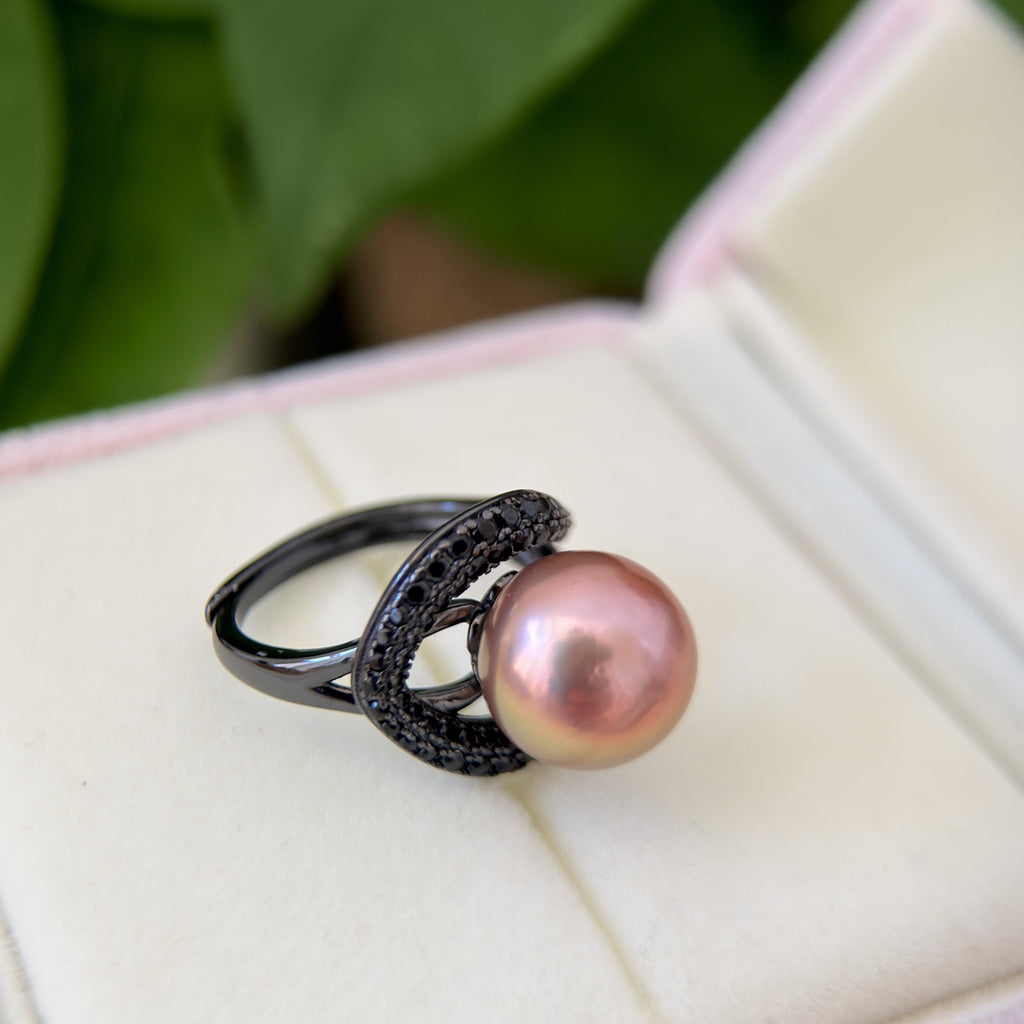 Modern gothic pearl jewelry with iridescent centre pearl.
