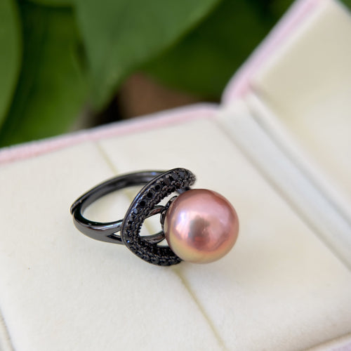 Modern gothic pearl jewelry with iridescent centre pearl.
