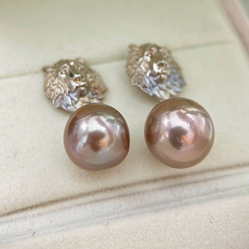 Mirror-luster bronze pearl earrings designed as bold statement jewelry.