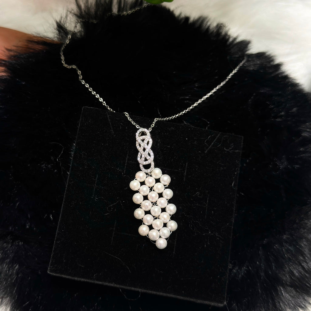 Romantic white pearl necklace styled for evening and special occasions.