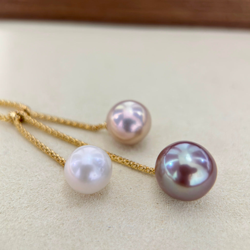 10.5 mm white freshwater pearl with delicate pink overtones.
