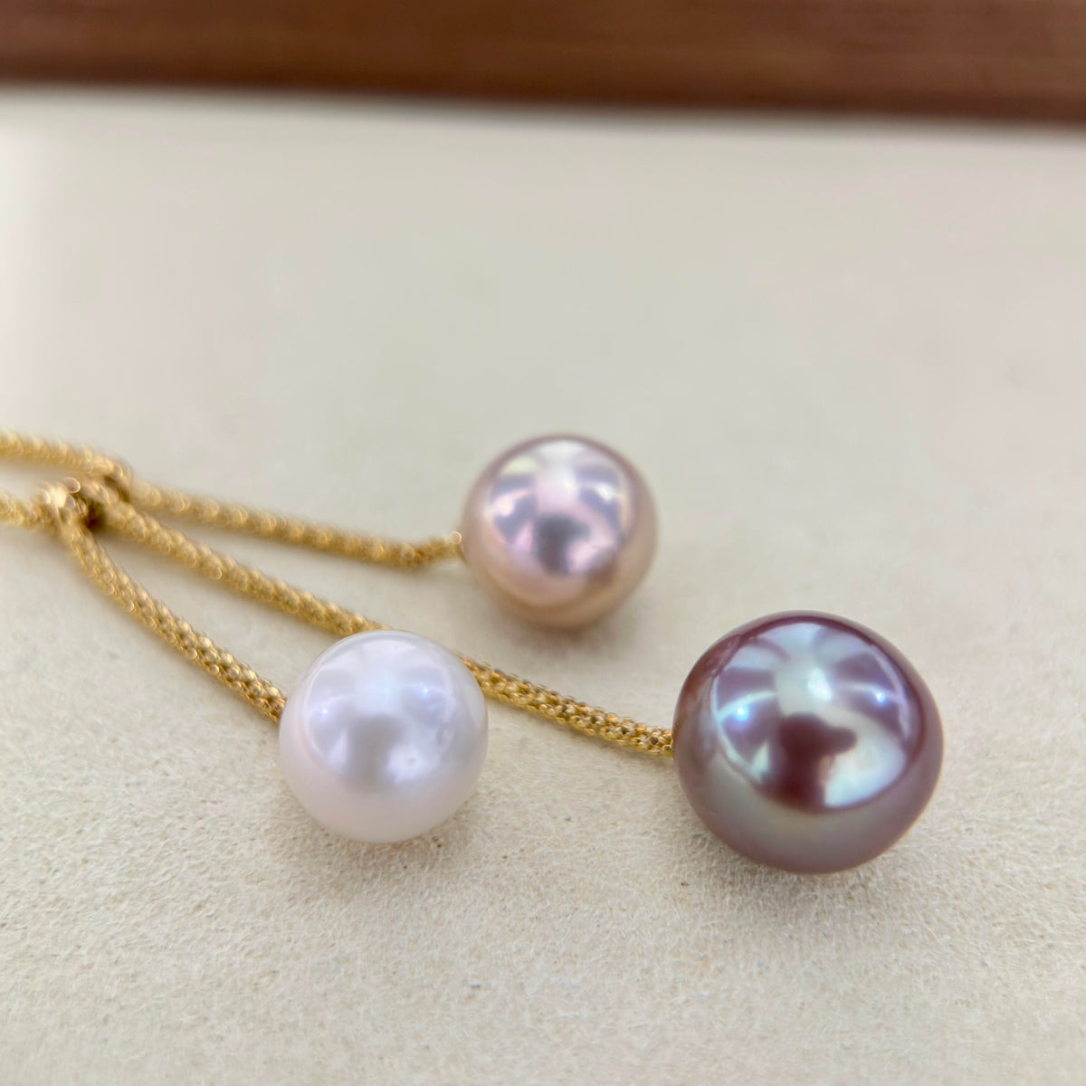 10.5 mm white freshwater pearl with delicate pink overtones.