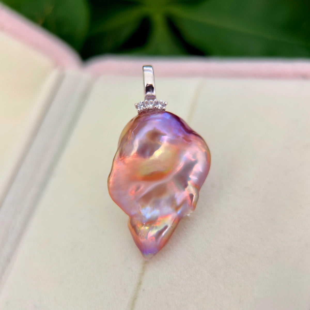 Multicolor baroque pearl pendant with a sterling silver bail.