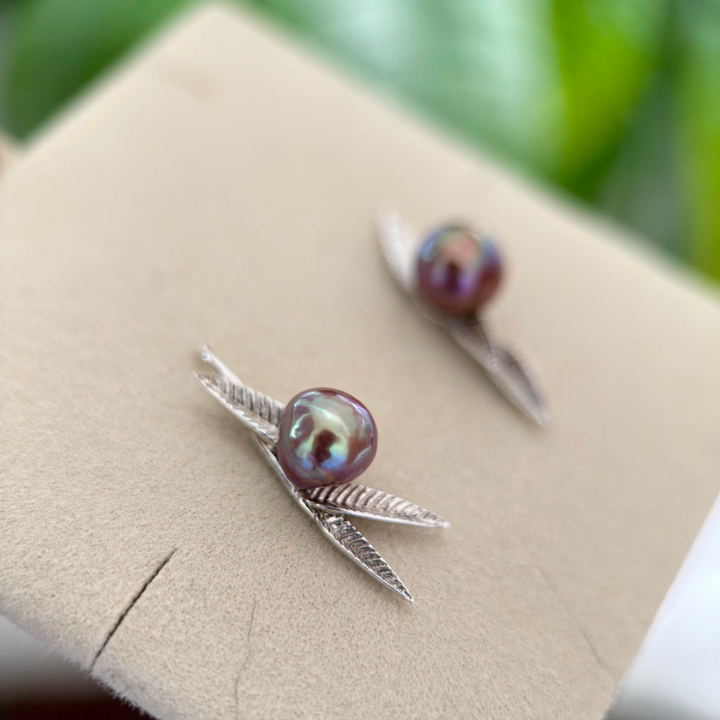 
Blue and red halo pearl earrings set in sterling silver.