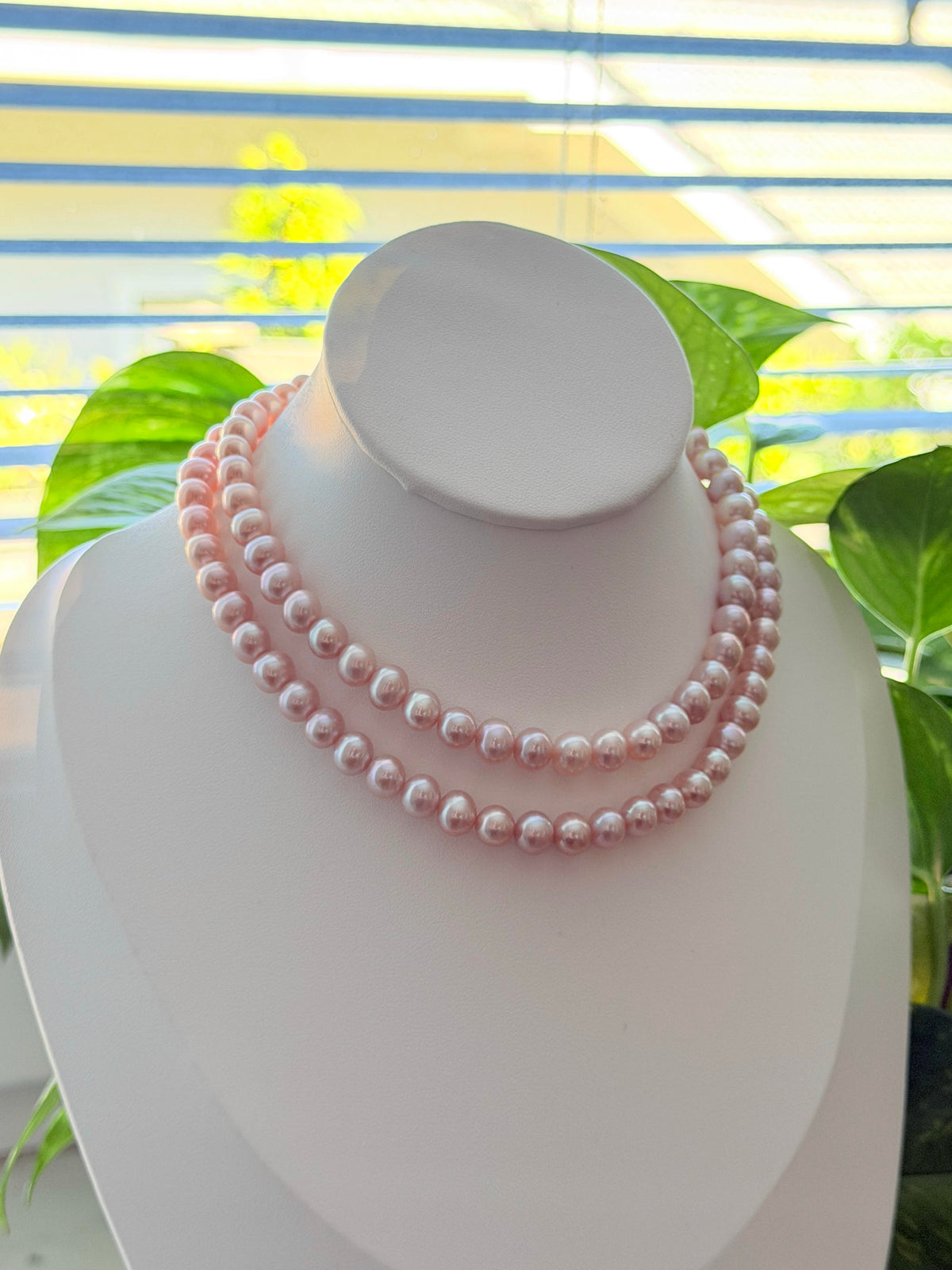Light pink freshwater pearl necklace with subtle soft purple overtones.