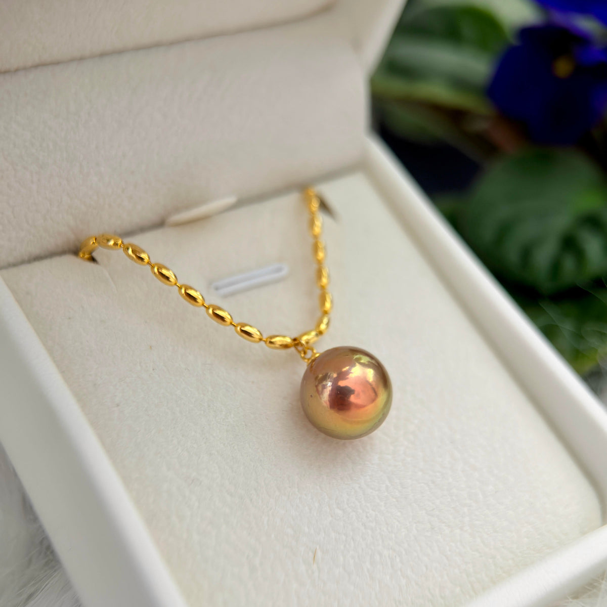 Minimalist green and golden pearl necklace with sterling silver chain.