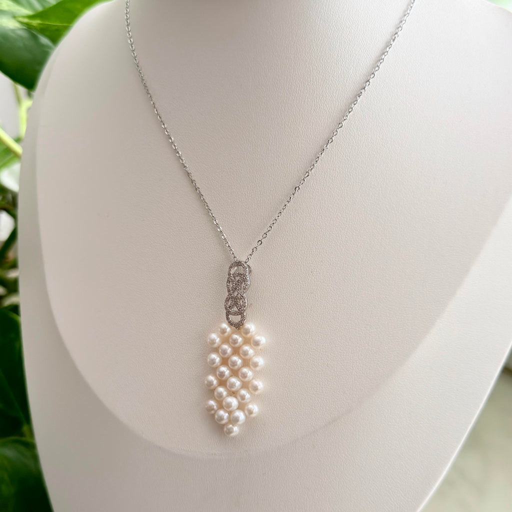 4.5 mm freshwater pearl pendant necklace with sparkling bow accent.
