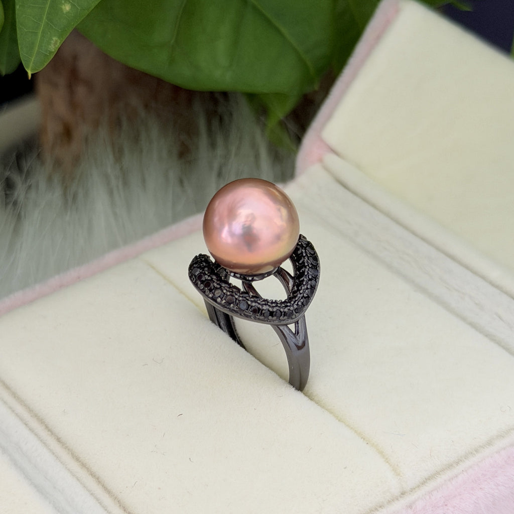 Dark pearl statement ring with adjustable band.