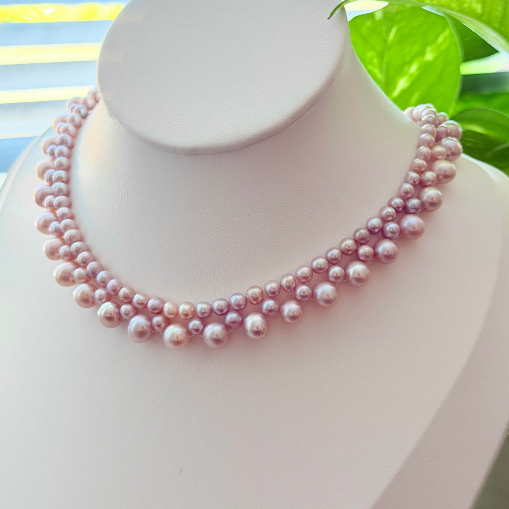 Braided pearl choker made with pink and purple freshwater pearls.
