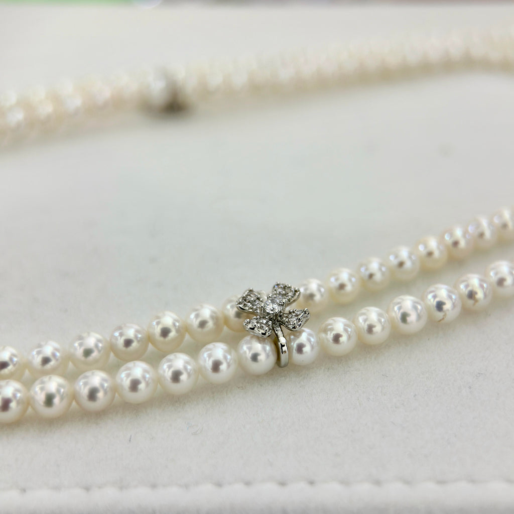 Regal double-strand choker featuring 4–5 mm white natural freshwater pearls.
