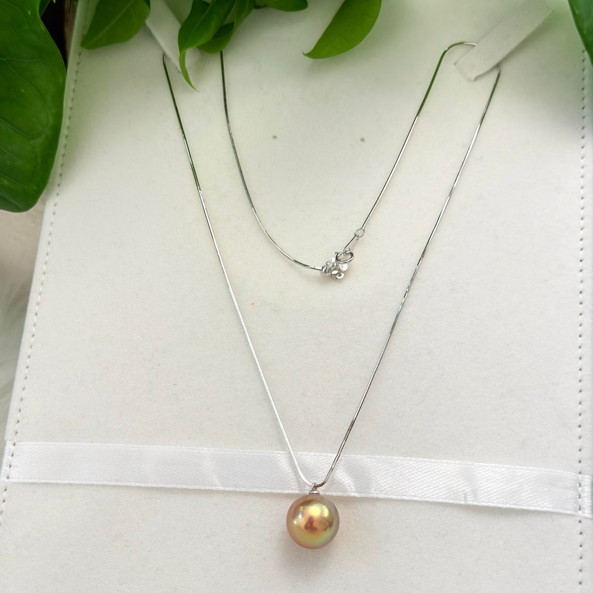 Minimalist multicolor pearl necklace with sterling silver chain.