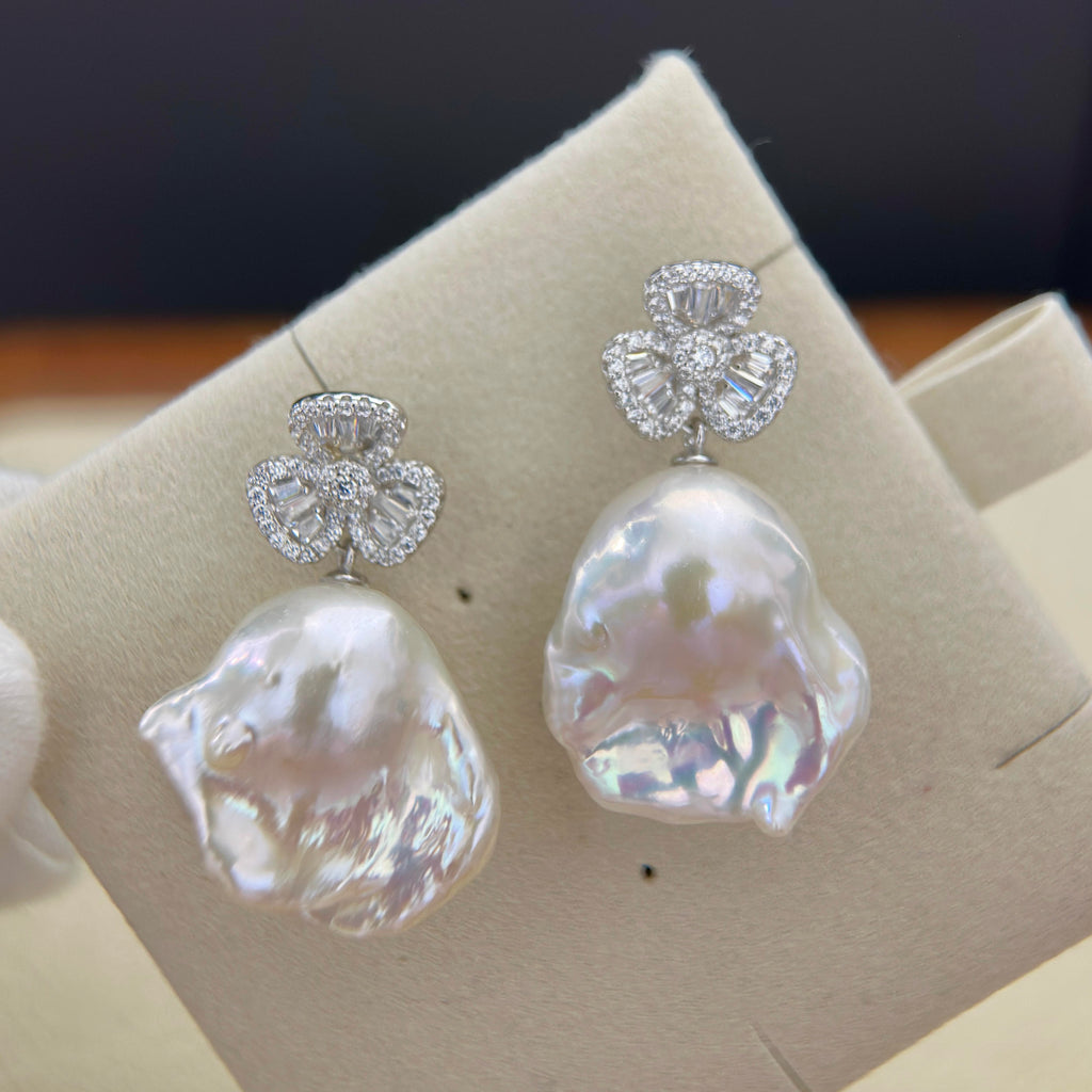 20 mm freshwater pearl earrings with sparkling cubic zirconia club studs.
