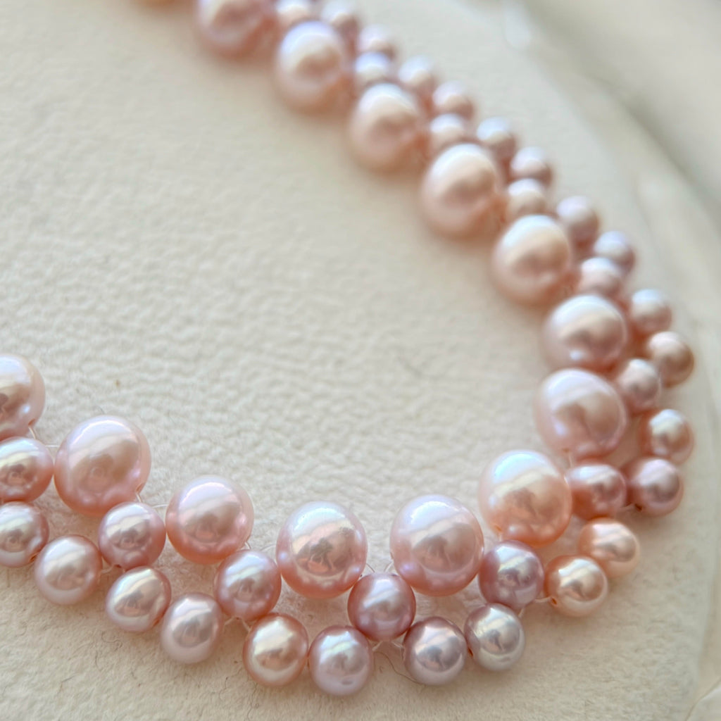 Close-up of the statement pearl choker with exceptionally bright pearls.