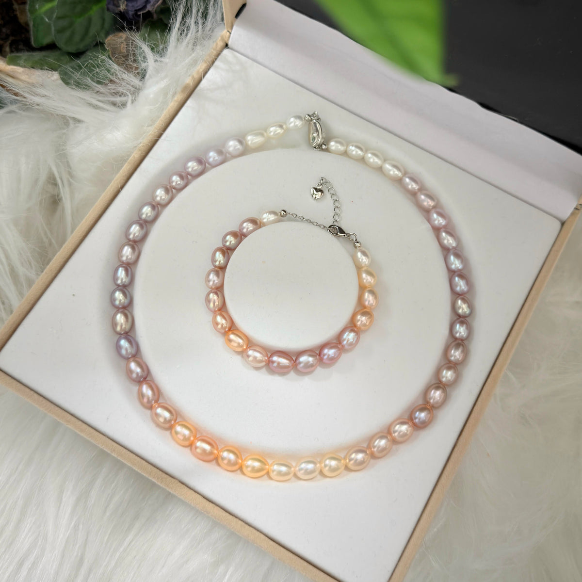 Close-up of the sterling silver clasp and pearl strand finishing.
