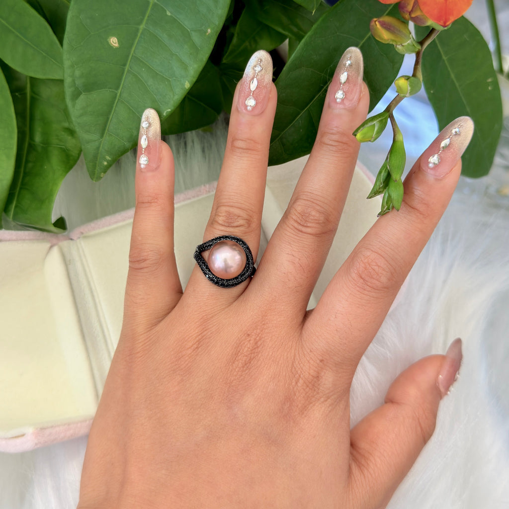 Natural freshwater pearl ring with dramatic gothic design.