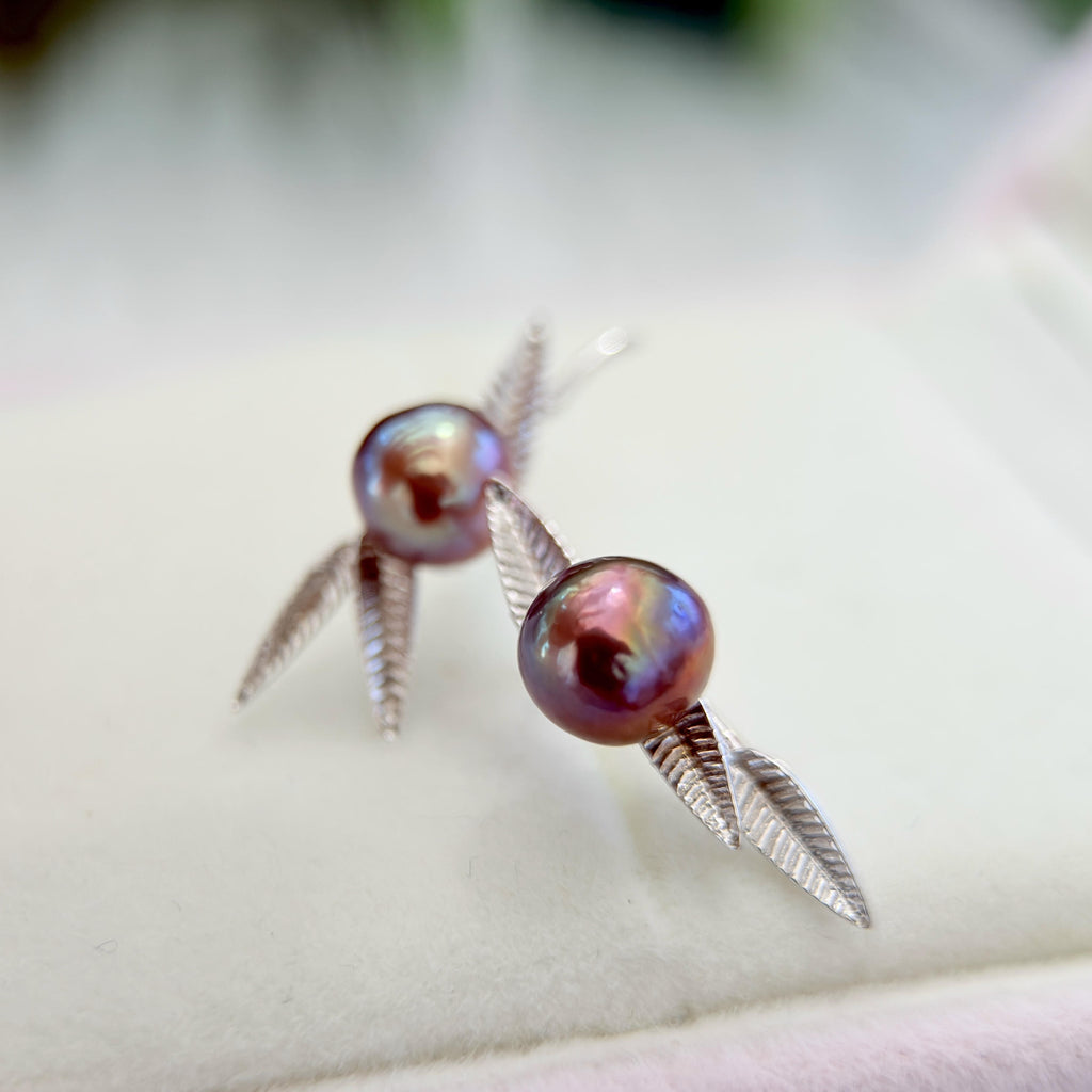 Bamboo leaf pearl stud earrings crafted in 925 sterling silver.