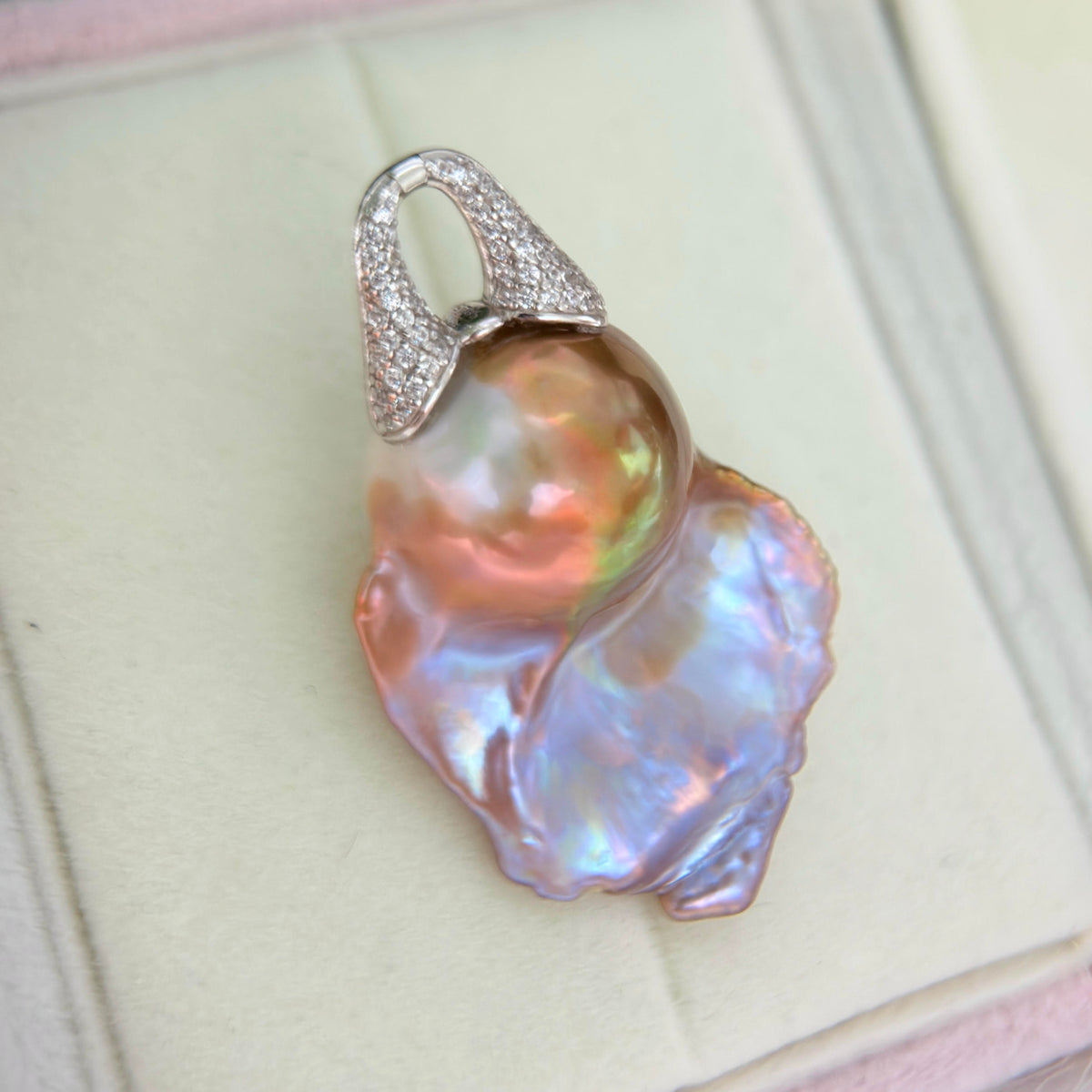 One-of-a-kind detachable pearl pendant with a large organic freshwater pearl.