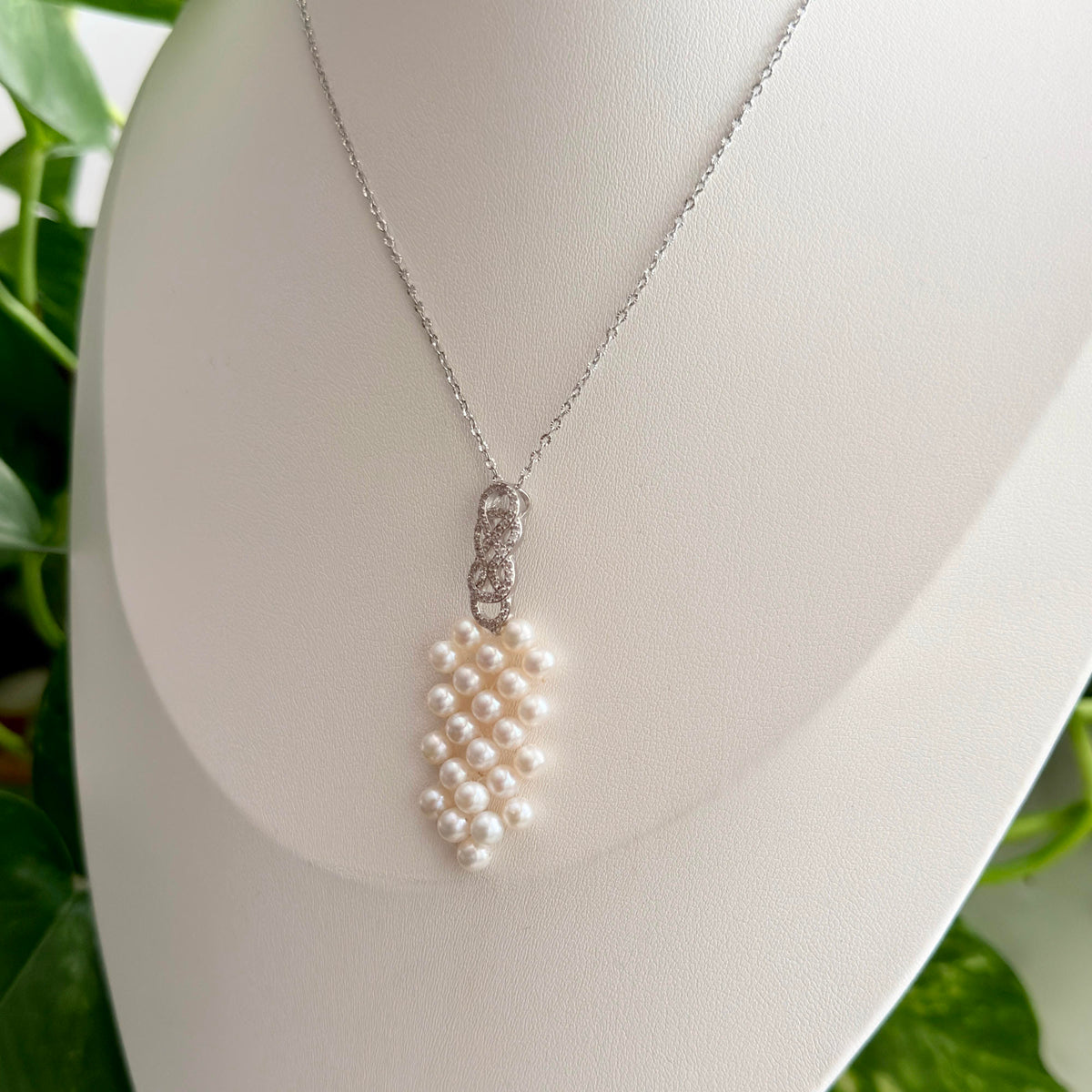 Long white pearl pendant necklace designed for elegant day-to-night wear.
