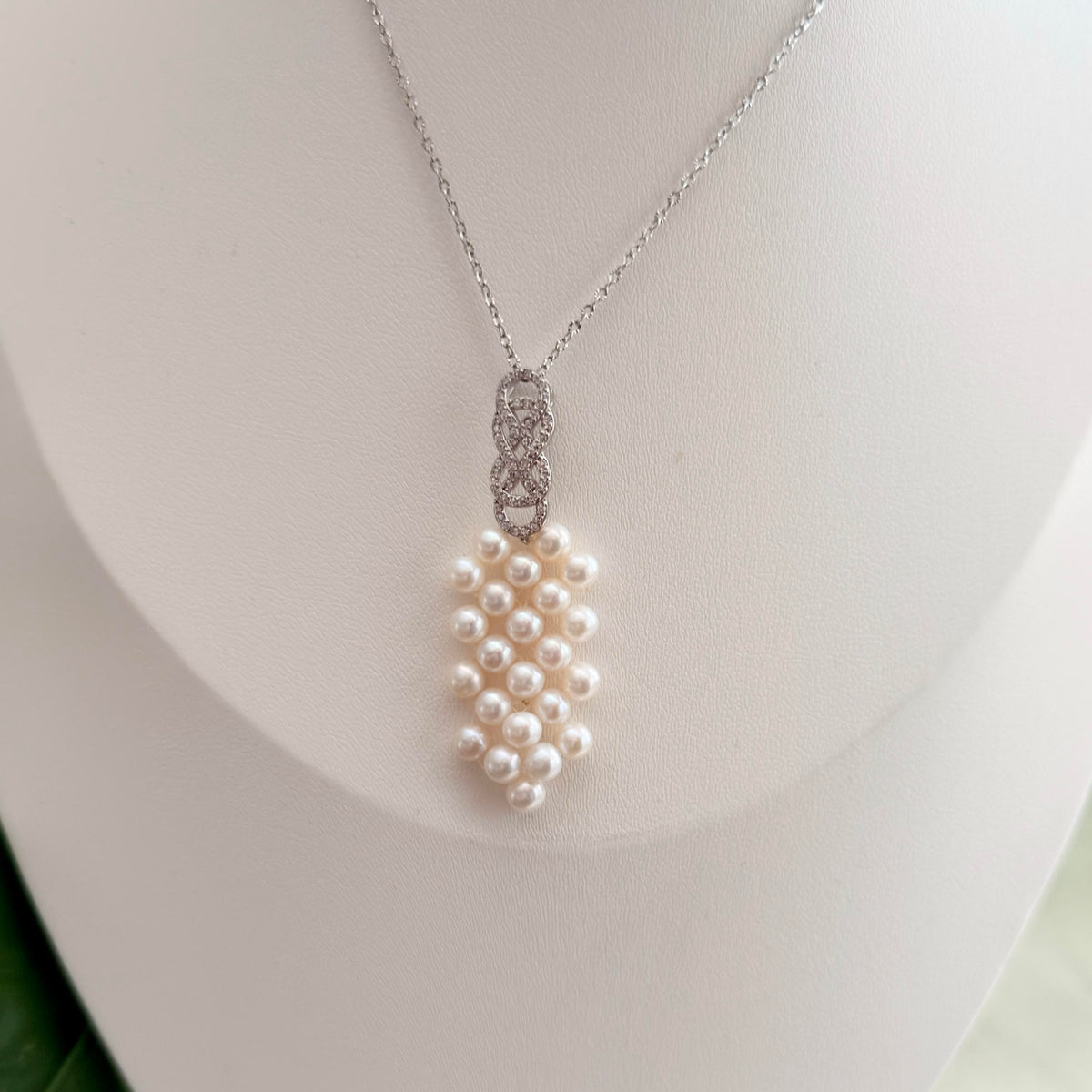 Romantic bow pearl necklace styled as an elegant jewelry gift.