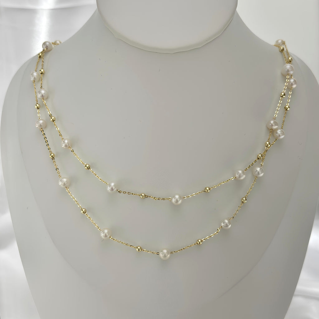 Long freshwater pearl necklace finished with an easy magnetic ball clasp.